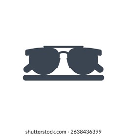 Icon of sunglasses placed on a surface.