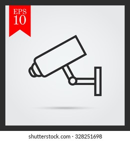 Icon of surveillance camera hanging on wall