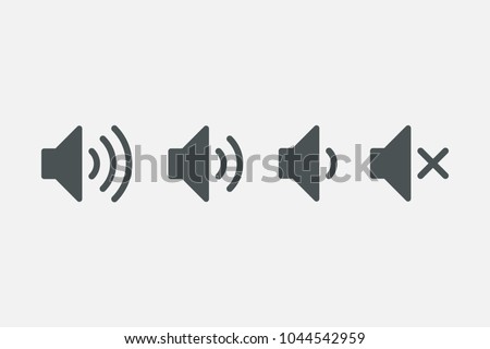An icon that increases and reduces the sound. Icon showing the mute. A set of sound icons with different signal levels in a flat style. Vector. Foto stock © 