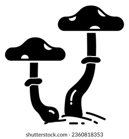 Icon of two stalks of mushrooms or fungi with speckled caps