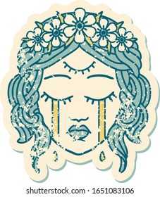 iconic distressed sticker tattoo style image of female face with third eye and crown of flowers cyring