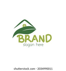 The iconic and modern roof design of the house ends with large green leaves,