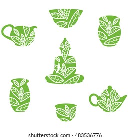 
Icons tea set for tea ceremony , teapot , bowls , tea pairs and a Buddha figurine with an ornament in the form of tea leaves inside
