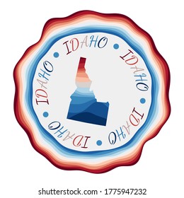 Idaho badge. Map of the us state with beautiful geometric waves and vibrant red blue frame. Vivid round Idaho logo. Vector illustration.