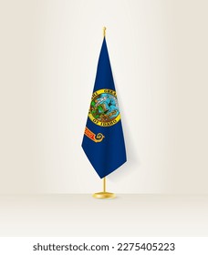 Idaho flag on a flag stand. Vector illustration.