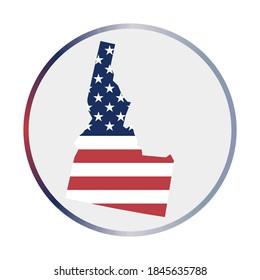 Idaho icon. Shape of the us state with Idaho flag. Round sign with flag colors gradient ring. Vibrant vector illustration.