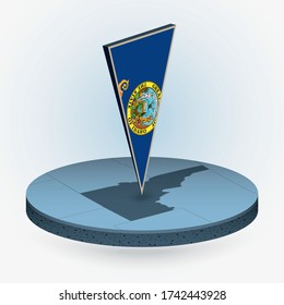 Idaho map in round isometric style with triangular 3D flag of US State Idaho, vector map in blue color.
