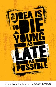 The Idea Is To Die Young As Late As Possible. Strong Inspiring Creative Life Motivation Quote Template. Vector Stencil Graffiti Typography Poster Design Concept On Textured Wall Rough Background