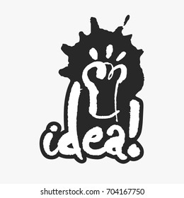 Idea. Hand written calligraphy phrase in an ink blot. White on black. Clipping paths included.