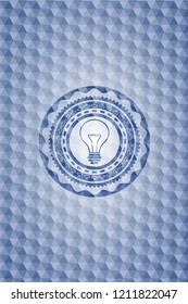 idea icon inside blue badge with geometric pattern.