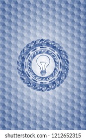 idea icon inside blue polygonal emblem.