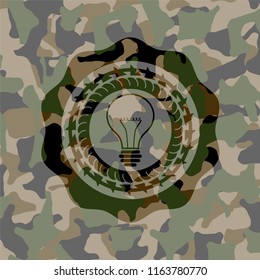 idea icon inside camouflaged emblem