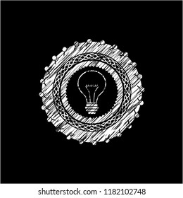 idea icon inside chalkboard emblem written on a blackboard