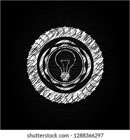 idea icon inside chalkboard emblem