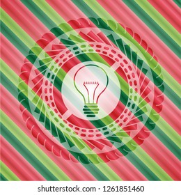 idea icon inside christmas badge.