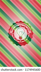 idea icon inside christmas style emblem.