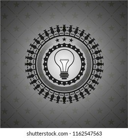 idea icon inside dark emblem