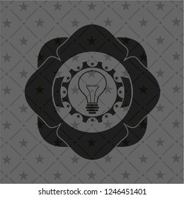 idea icon inside dark emblem