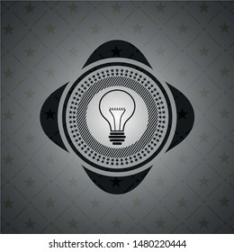 idea icon inside dark emblem