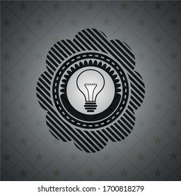 idea icon inside dark emblem