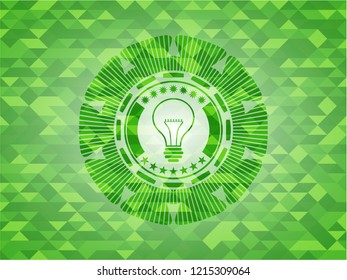 idea icon inside green emblem with triangle mosaic background