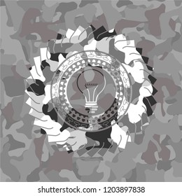 idea icon inside grey camo texture