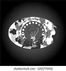 idea icon inside grey camo emblem