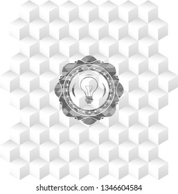 idea icon inside grey emblem with geometric cube white background