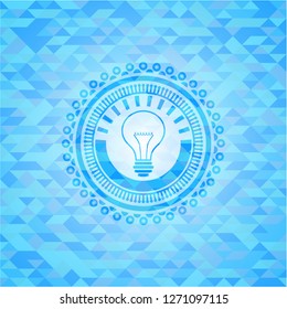 idea icon inside light blue mosaic emblem
