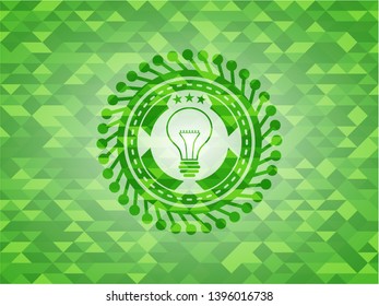idea icon inside realistic green mosaic emblem