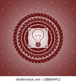 idea icon inside realistic red emblem