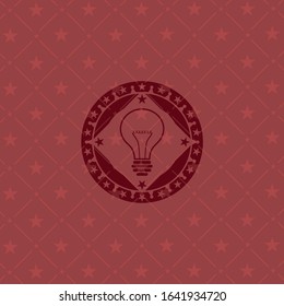 idea icon inside red emblem
