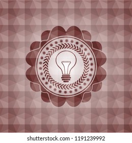 idea icon inside red seamless badge with geometric pattern.