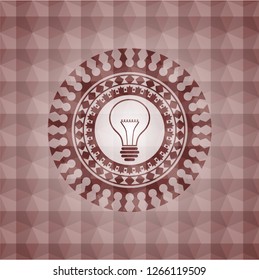 idea icon inside red seamless badge with geometric pattern background.