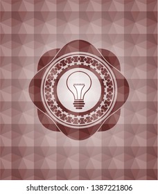 idea icon inside red seamless emblem with geometric background.