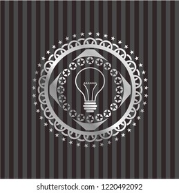idea icon inside silver emblem or badge