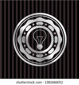 idea icon inside silvery emblem or badge