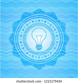 idea icon inside sky blue water wave emblem background.