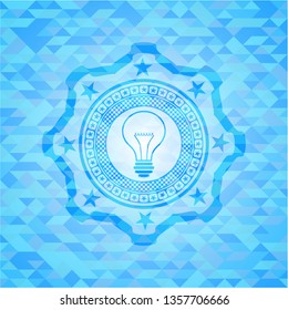 idea icon inside sky blue emblem with mosaic background