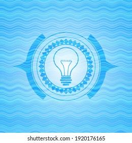 idea icon inside sky blue water emblem background. 