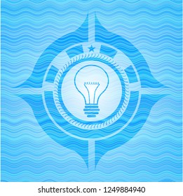 idea icon inside water concept style badge.