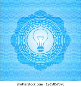 idea icon inside water concept emblem.