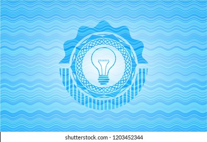 idea icon inside water wave style emblem.