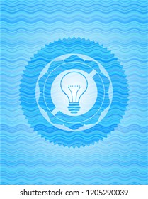 idea icon inside water wave badge.
