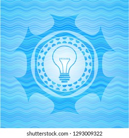 idea icon inside water wave emblem.
