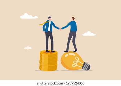 Idea pitching, fund raising and venture capital, selling business or merger agreement concept, entrepreneur businessman standing on lightbulb idea lamp shaking hands with VC on money coins stack.