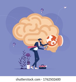 Idea Research Concept-Businessman with magnifying glass looking inside a brain