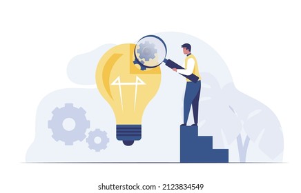 Idea Research Concept-Businessman with magnifying glass looking inside a light bulb