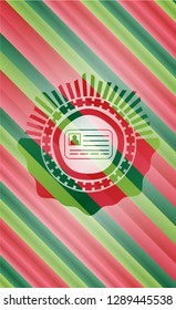 identification card icon inside christmas colors badge.