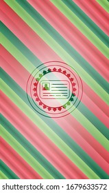 identification card icon inside christmas colors badge.